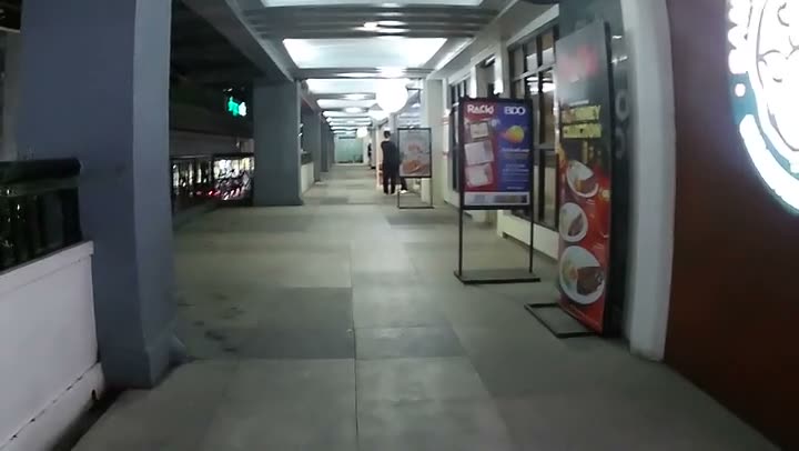 First-person point-of-view video still of walking through an everyday environment